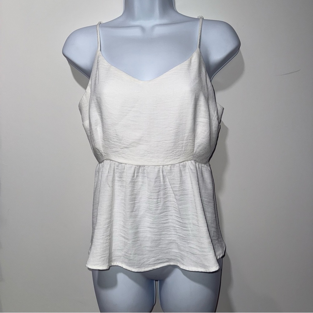 White top with adjustable straps. Never worn. Size XL